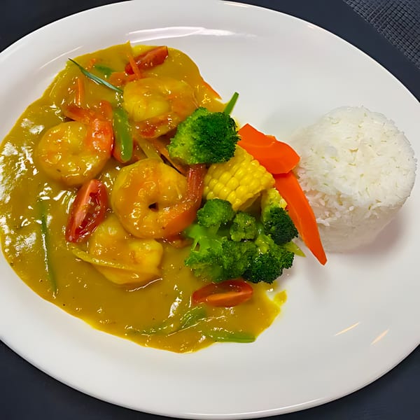 Trelawny Fusion Kitchen's Jamaican curry shrimp with broccoli, corn, carrots, and white rice.